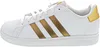 A side view of a white Adidas sneaker with gold stripes. Produktbild-Vorschau