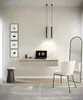 A modern home office or dressing area with a floating desk, chair, mirror, and decorative items. Voir les images du produit