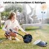A woman is kneeling in a garden, holding a cordless cleaning tool connected to a pool robot on the ground. Anteprima dell’immagine prodotto