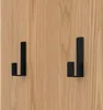 Two black hooks mounted on a wooden surface. Produktbild-Vorschau