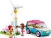 A LEGO set featuring a wind turbine, a car, two mini-doll figures, and a dog. Náhled obrázku produktu