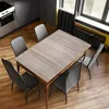 A dining table with chairs in a modern room. Produktbild-Vorschau