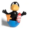 A toy raven figure with a rocket is sitting in a blue base. Produktbild-Vorschau