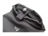 A close-up shot of a dark grey fabric pouch with a Logitech logo and a USB adapter attached. Anteprima dell’immagine prodotto