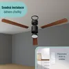 A ceiling fan assembly with its parts separated, and a remote control holder on a wall. Náhled obrázku produktu