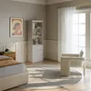 A bedroom scene with a bookshelf, bed, and chair. Produktbild-Vorschau