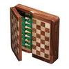 A wooden chess set with pieces stored inside, shown open. Podgląd zdjęcia produktu
