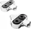 Two silver and black bicycle pedal cleats on a white background. Produktbild-Vorschau