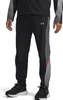 A person wearing Under Armour training pants and shoes. Produktbild-Vorschau