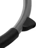 A close-up view of a gray curved metal frame with black rubber grips and a black plastic piece attached. Produktbild-Vorschau