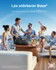 People enjoying drinks on a yacht with a portable speaker. Voir les images du produit