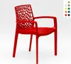 A red plastic chair with an openwork design is shown against a white background. Produktbild-Vorschau