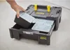 A hand is shown placing a small container into a modular tool box. Voir les images du produit