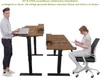 A man standing at a desk and a woman sitting at a desk, demonstrating the adjustable height of the desks. Anteprima dell’immagine prodotto