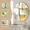 A round gold-framed mirror is displayed on a wall above a dresser, with decorative elements and text callouts highlighting product features. Produktbild-Vorschau