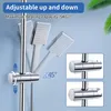 Close-up of a showerhead holder adjustable on a shower rod, with a blue background and green leaves at the top right. Produktbild-Vorschau