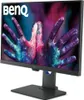 A BenQ monitor is displayed on a stand against a black background. The monitor screen shows a colorful image of hands covered in paint. Produktbild-Vorschau