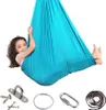 A young girl is playing in a blue hammock swing, with various hardware accessories laid out below. Náhled obrázku produktu