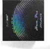 The image shows the packaging of a speaker with a holographic dot pattern and text. Podgląd zdjęcia produktu