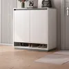 A modern shoe cabinet with shoes stored on the open shelf. Náhľad obrázku produktu