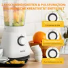 A white blender is shown on a countertop with fruits and other kitchen items. The image highlights the blender's features with text overlays and diagrams. Produktbild-Vorschau
