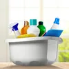 A collection of cleaning supplies in a white basin, set against a blurred background of a window with greenery outside. Produktbild-Vorschau