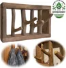A collage of images showing a wooden coat rack with branch-like hooks, a close-up of the hooks, and a detail of a towel hanging on the rack. Produktbild-Vorschau