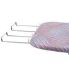 A close-up view of the edge of an ironing board with a patterned cover and metal supports. Podgląd zdjęcia produktu
