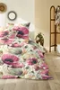 A bedroom scene with a bed dressed in floral bedding. Produktbild-Vorschau