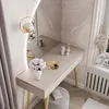 A modern vanity table with a mirror, set in a well-lit room with decorative elements. Náhľad obrázku produktu