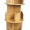 A close-up view of a wooden rotating bookshelf against a white background. Produktbild-Vorschau