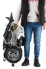 A person holding a folded electric wheelchair. Náhľad obrázku produktu