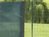 A close-up view of a green privacy screen attached to a wire fence. Náhľad obrázku produktu