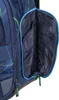 A close-up view of an open side pocket of a blue backpack with a geometric pattern. Produktbild-Vorschau