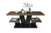 A modern coffee table with a wood-effect top and black base, decorated with a vase of branches and two cups. Produktbild-Vorschau