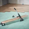 A vinyl and laminate cutter is being used to cut a piece of laminate flooring in a room that is being renovated. Produktbild-Vorschau