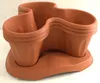 A terracotta-colored modular planter set with a base tray. Anteprima dell’immagine prodotto