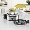 An egg cooker and a glass on a countertop. Produktbild-Vorschau