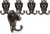 A set of cast iron cow head wall hooks. Produktbild-Vorschau
