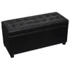 A black upholstered storage bench with tufted detailing. Podgląd zdjęcia produktu