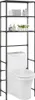A black metal shelving unit with three shelves is placed over a white toilet. The shelves contain towels, bottles, and a decorative plant. Náhled obrázku produktu