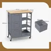 A kitchen cart with dimensions shown, and a separate crate with dimensions shown. Podgląd zdjęcia produktu