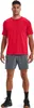 A man is standing and posing for a product photo, wearing a red t-shirt and gray shorts. Náhľad obrázku produktu