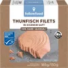 A close-up of tuna fillets in a box, with product information and certifications visible. Produktbild-Vorschau