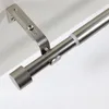 Close-up view of a metal curtain rod with a bracket and end cap. Produktbild-Vorschau