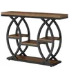 A console table with a wooden top and black metal frame with circular accents and shelves. Voir les images du produit