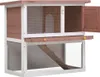 A two-tiered wooden rabbit hutch with wire mesh sides and a ramp. Anteprima dell’immagine prodotto