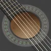 A close-up view of a black classical guitar, focusing on the soundhole and strings. Náhľad obrázku produktu