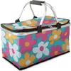 A floral print picnic basket with a silver frame and handles. Náhled obrázku produktu