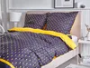 A bed with a duvet and pillows, set in a bedroom. Náhled obrázku produktu